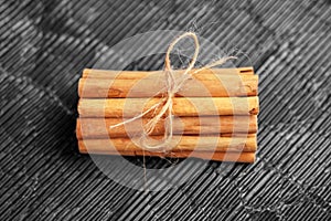 Cinnamon sticks bundle with rope. Aromatic seasoning