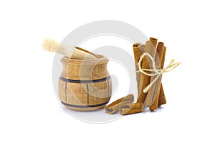 Cinnamon sticks bundle and a small wooden pot