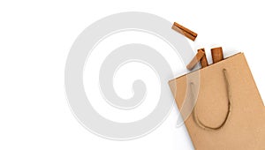 Cinnamon sticks in cardboard bag, healthy cooking ingredient, aroma spice