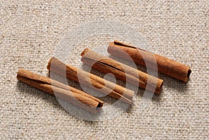 Cinnamon sticks on a linen fabric