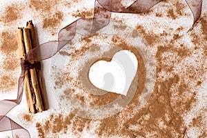 Cinnamon sticks with organza ribbon and cinnamon powder heart shaped