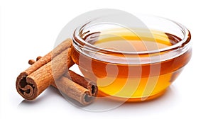 Cinnamon Sticks with Honey in a Bowl on Isolated White Background photo