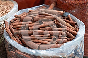 Cinnamon sticks in a plastic bags at bazaar