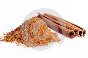 Cinnamon sticks and powder isolated on white background, close up