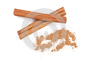 Cinnamon sticks with powder isolated on white background. Top view