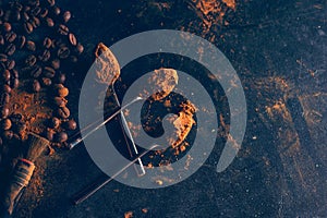 Cinnamon sticks powder in spoons coffee beans