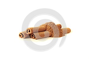 Cinnamon sticks and powder on white background