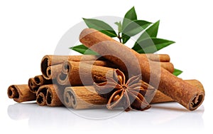 Cinnamon sticks with star anise and green leaves