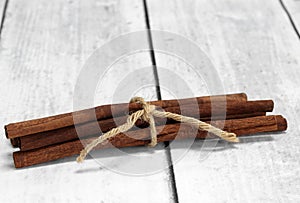 Cinnamon Sticks tied with jute, macro with copy space.