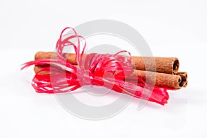 Cinnamon sticks tied with a red ribbon