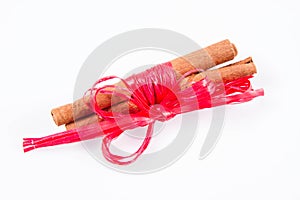 Cinnamon sticks tied with a red ribbon