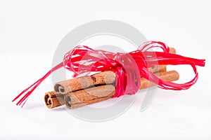 Cinnamon sticks tied with a red ribbon