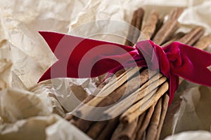 Cinnamon sticks tied with a red ribbon
