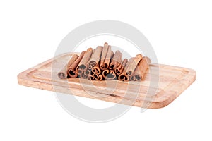 Cinnamon sticks on wood background