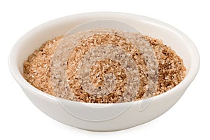 Cinnamon sugar in a white ceramic bowl isolated on white