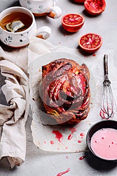 Cinnamon Swirl Bread with Blood Orange Glaze..selective focus