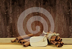 Cinnamon on the wooden background.