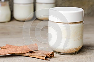 Cinnamon yogurt, rustic background.