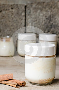Cinnamon yogurt, rustic background.