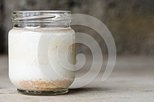 Cinnamon yogurt, rustic background.