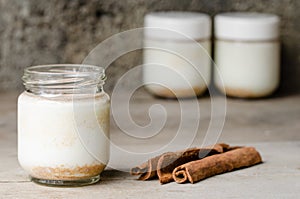 Cinnamon yogurt, rustic background.