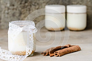 Cinnamon yogurt, rustic background.