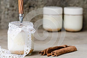 Cinnamon yogurt, rustic background.