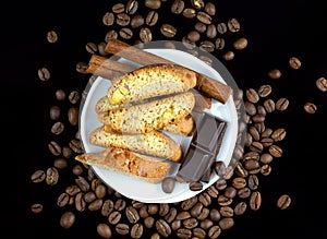 Cinnanon sticks, chocolate, bisquits and coffee photo