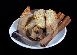 Cinnanon sticks, chocolate and bisquits photo