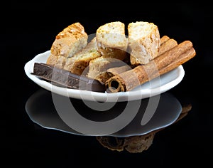 Cinnanon sticks, chocolate and bisquits photo