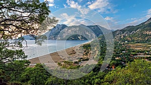 Cirali village, Turkey. Picturesque beach, sea, mountains and pine trees on the beach.