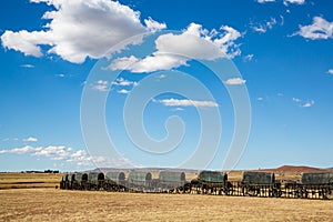 Circle of 64 replica Voortrekker wagons cast in bronze at Blood River Heritage Site, KwaZulu-Natal, South Africa