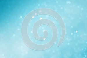 Circle bokeh blurred on sea blue background abstract