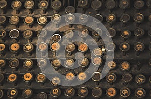 Circle buttons of old type writer matchine in dark light photo