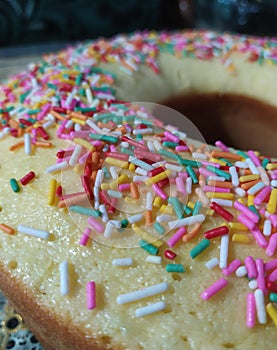 Circle cake with rainbow meses photo