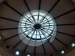 circle ceiling roof glasses supported by a dark green steel frame