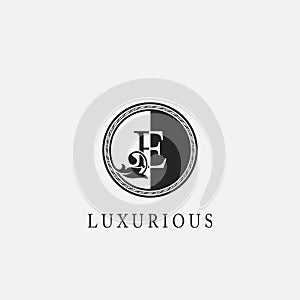 Circle E Letter Logo Icon. Classy Vintage Ornate Leaf Shape design on black and white color for business initial like fashion,