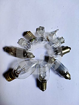 A circle group of filament bulbs isolated in white.