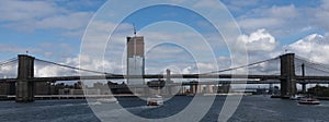 Circle line and other tour boats heading under the Brooklyn Bridge