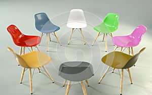 Circle of modern design chairs with one odd one out. Job opportunity.