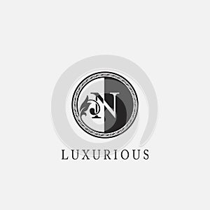Circle N Letter Logo Icon. Classy Vintage Ornate Leaf Shape design on black and white color for business initial like fashion,
