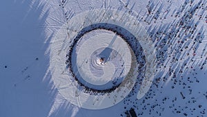 Circle of people which watch burning of dummy during celebration of Russian traditional holiday Maslenitsa. Footage