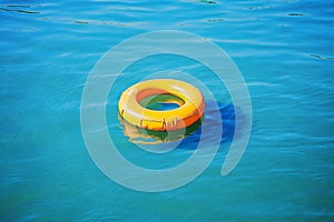 circle resort water pool yellow sunlight vacation rescue float ring. Generative AI.