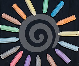 Circle of sidewalk chalk on chalk board