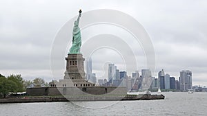 Circle Statue of Liberty From Boat on Cloudy Day