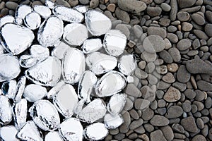 Circle of stones covered with foil photo