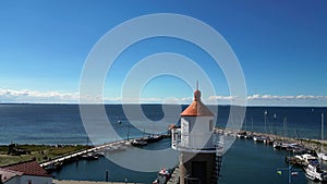 Circle the top of the lighthouse. Wonderful aerial view flight island poel