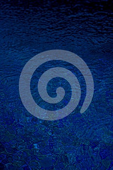 Circle water ripple wave surface background. Rain drop on swimming pool, blue background