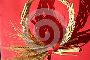 Circle wreath a bundle of wheat with two red paper hearts, valentine day, love and romance, prophecy