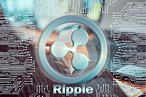 Circuit board on background of  man working at laptop and holding smartphone in his hands. ripple XRP cryptocurrency symbol.